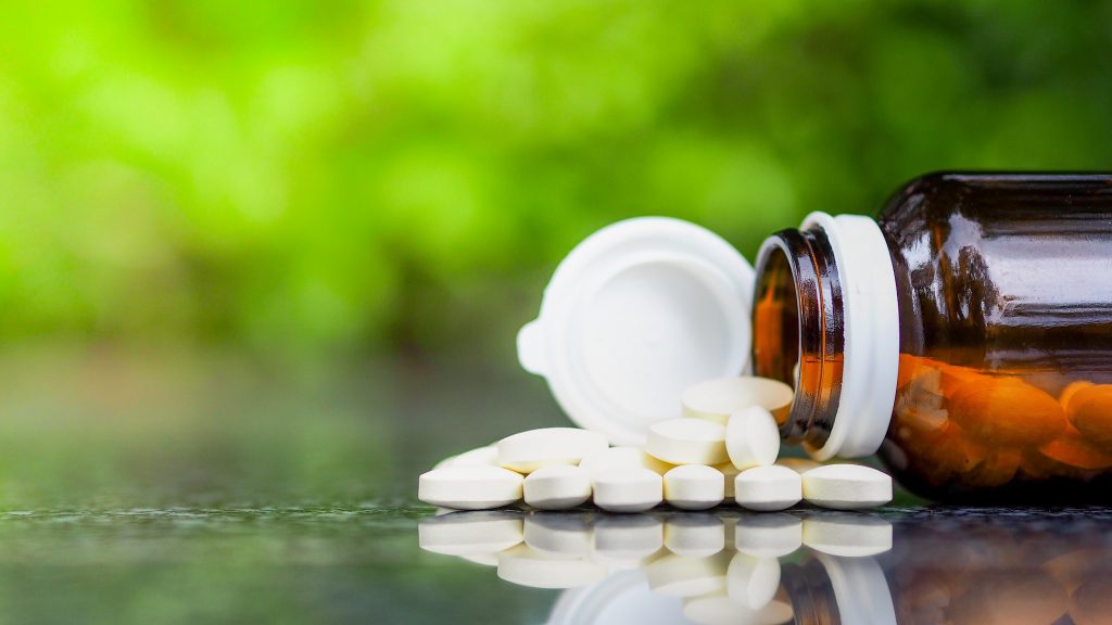 Multivitamin spilling out onto table